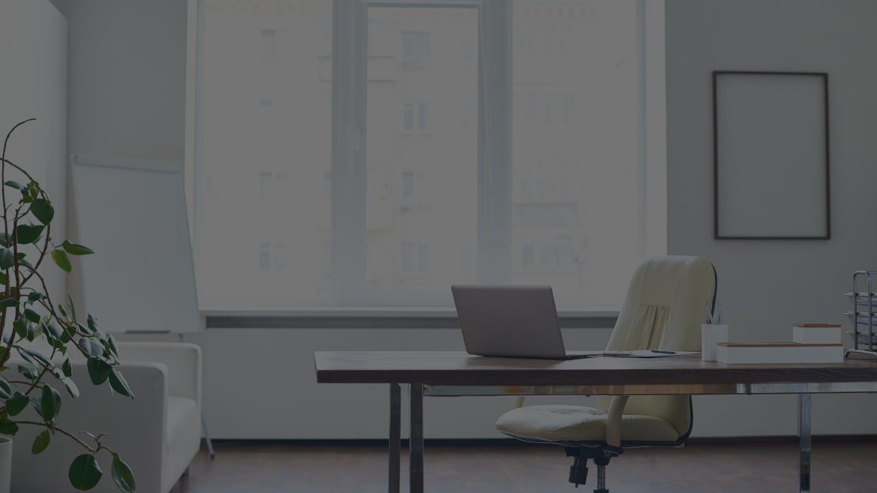 Empty office desk symbolizing cost of vacancy.